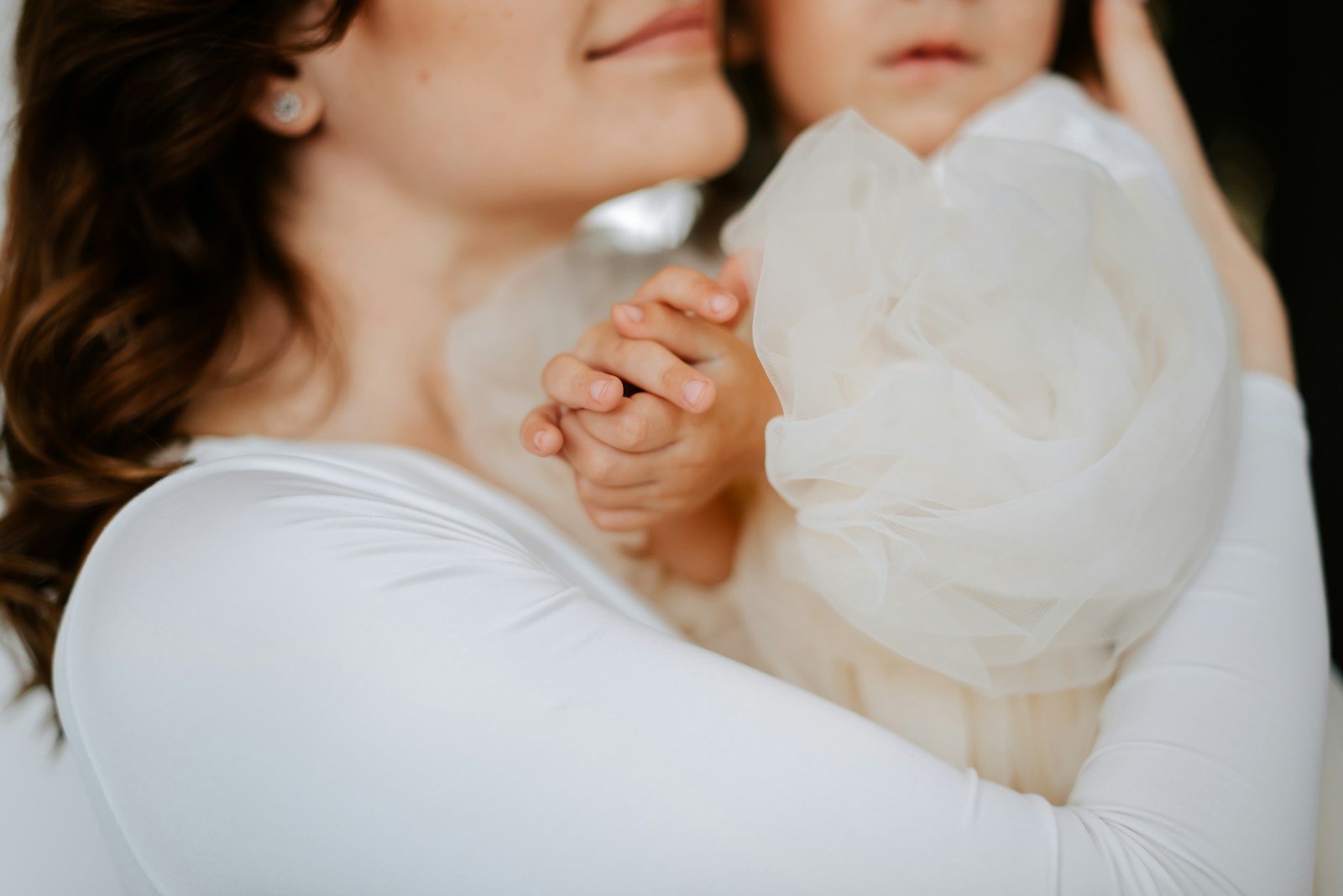 a woman holding a baby in her arms